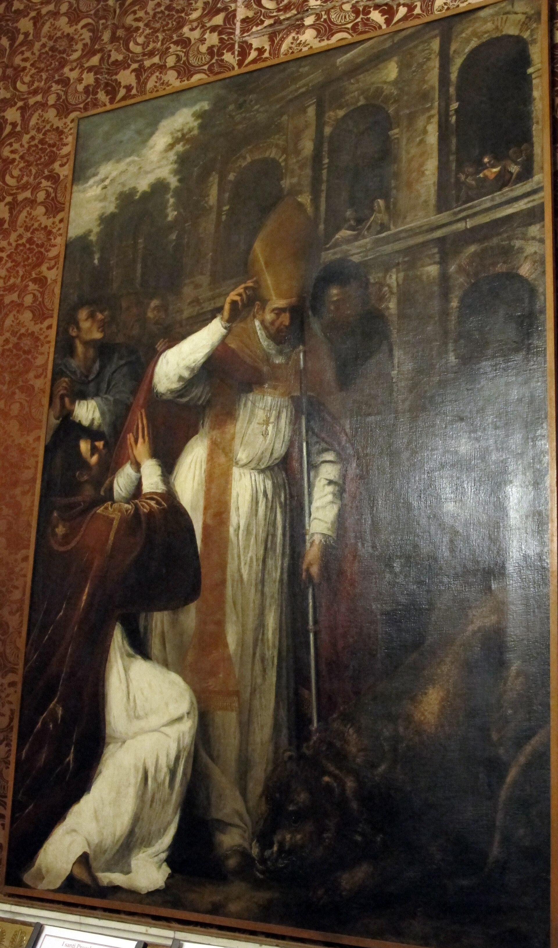 San Jenaro, revestido de obispo, permanece sereno ante las fieras en el anfiteatro de Pozzuoli