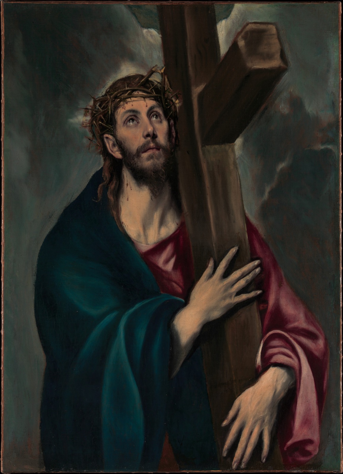 Cristo abraza la cruz y dirige la mirada hacia lo alto
