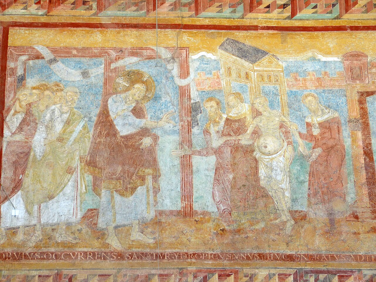 Cristo, con nimbo crucífero, extiende la mano hacia un hombre de abdomen hinchado sostenido por acompañantes, en una pintura mural medieval.